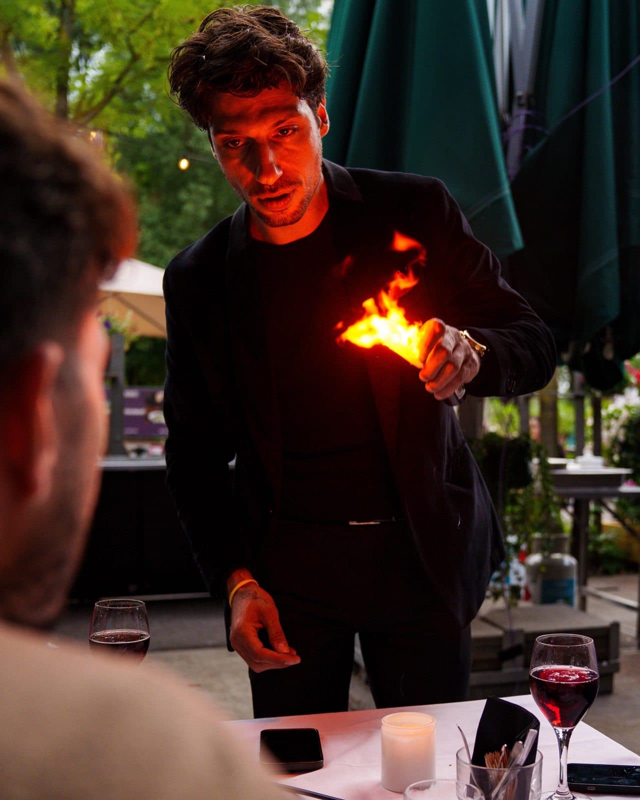 Lion with a flame in his hand at a candlelit dinner