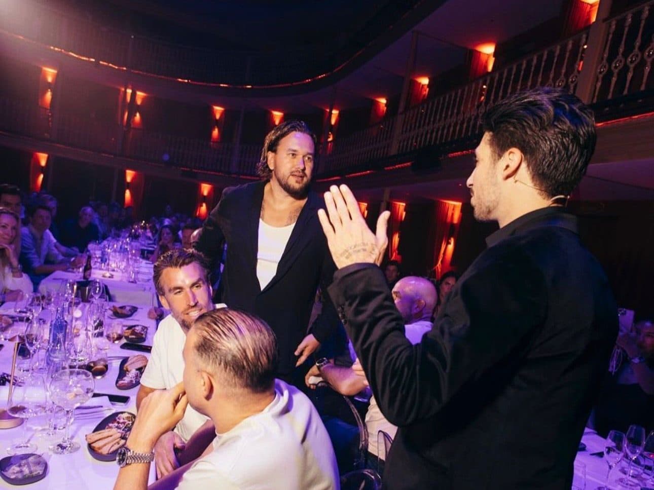 Lion among guests at a gala dinner